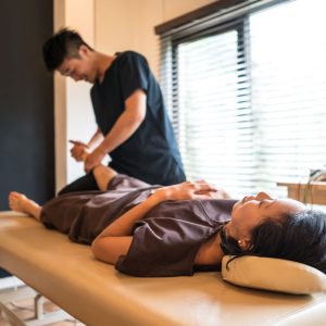 chiropractor adjust patient's foot