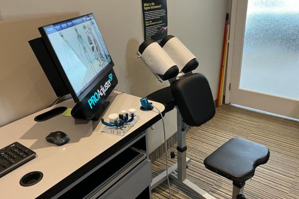 Sigma Instrument and chiropractic chair in an office